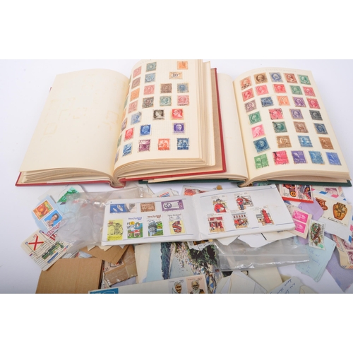 467 - A collection of early 20th century and later British and foreign stamps held between two presentatio... 