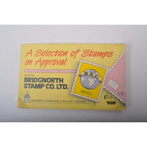 467 - A collection of early 20th century and later British and foreign stamps held between two presentatio... 