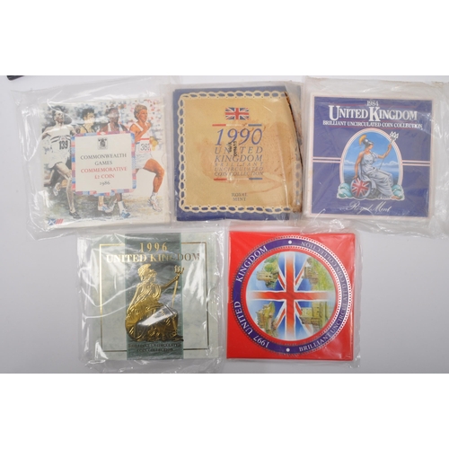 495A - An assortment of vintage 20th century commemorative uncirculated coins sets. The lot to include a 19... 