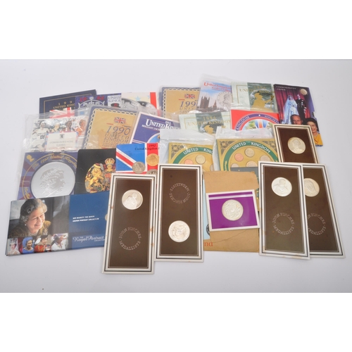 495A - An assortment of vintage 20th century commemorative uncirculated coins sets. The lot to include a 19... 