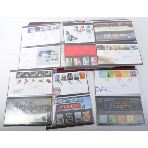 517 - An extensive 2002 to 2004 presentation packs & first day cover stamps album. The collection comprisi... 