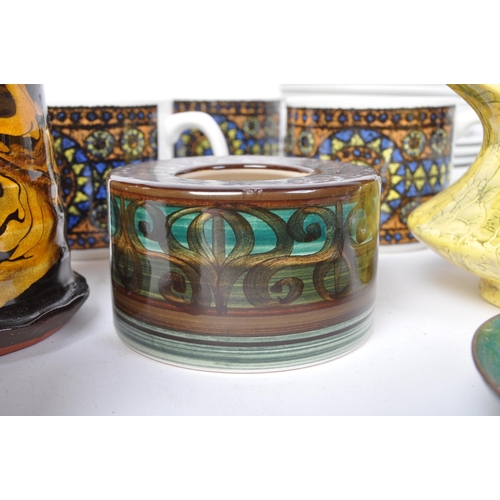 63 - A large collection of vintage retro 20th century drip glaze studio art pottery to include Jersey, Sy... 