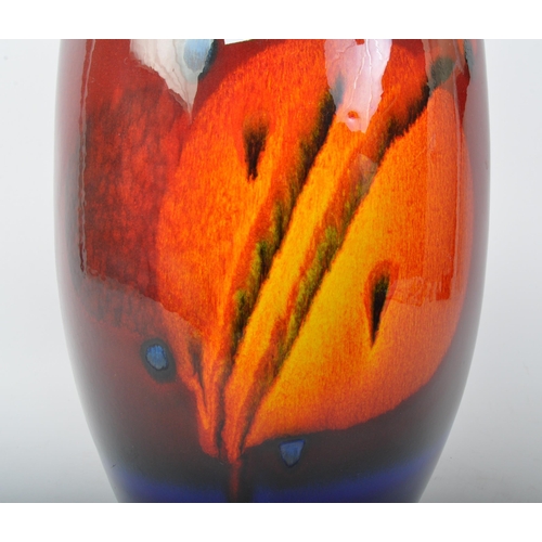 73 - Alan Clarke Studio -  A flattened ovoid potter glazed vase, with a timeslip sunset pattern, stamp to... 