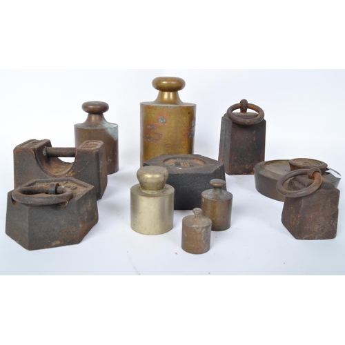 75 - A large collection of early 20th century measuring weights to include butchers weights, bell weights... 