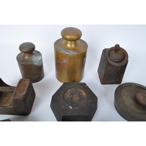 75 - A large collection of early 20th century measuring weights to include butchers weights, bell weights... 