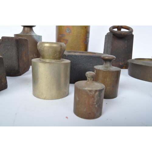 75 - A large collection of early 20th century measuring weights to include butchers weights, bell weights... 