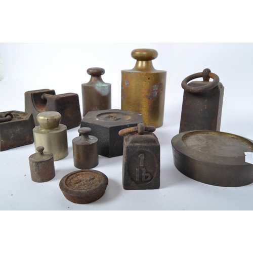 75 - A large collection of early 20th century measuring weights to include butchers weights, bell weights... 