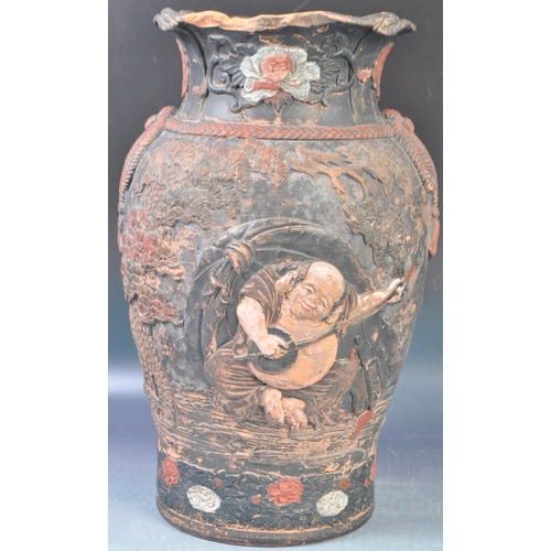 50 - An 19th Century Japanese Meiji period terracotta hand painted vase having a flared rim
 with floral ... 