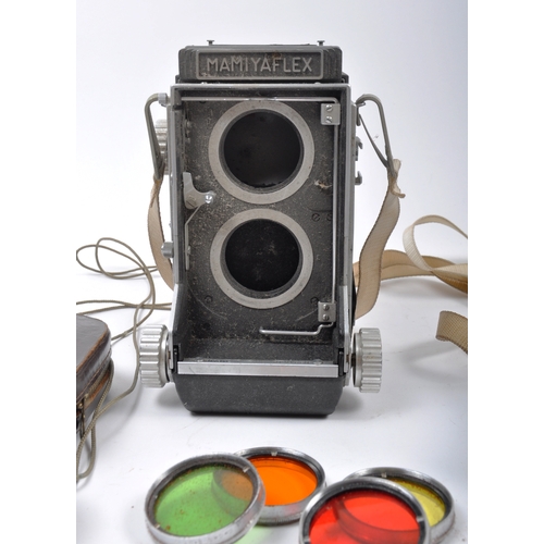 261 - Two Mamiyaflex twin lens reflex medium format cameras. One body with fitted f = 80mm 1 : 2.8 lens, t... 