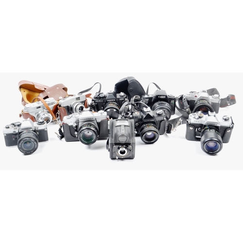 263 - A collection of 10 x vintage SLR 35mm film cameras. Models are: Topcon RM300 - lens 55mm f1.7, Arett... 