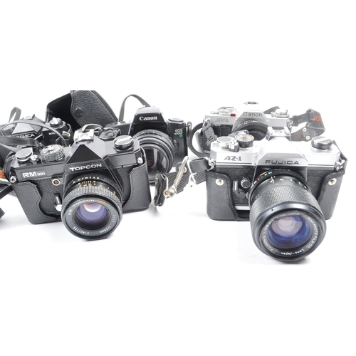 263 - A collection of 10 x vintage SLR 35mm film cameras. Models are: Topcon RM300 - lens 55mm f1.7, Arett... 