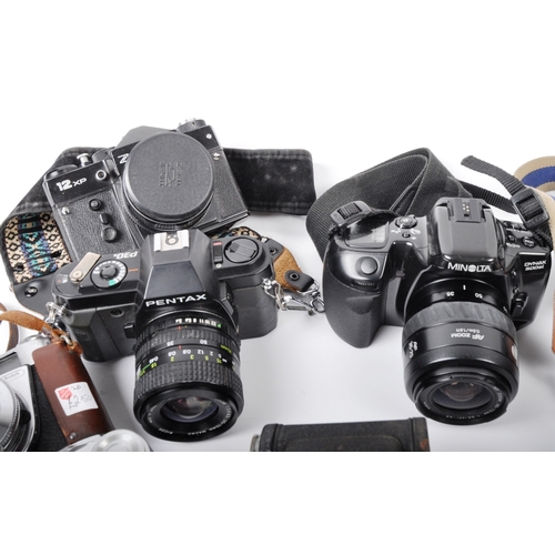 297 - A mixed collection of 12 x vintage film cameras. Models are: Pentax P30N - lens Ricoh 35-70mm f3.4-4... 