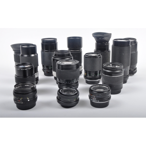 317 - A collection of camera lenses. Models are: Yashica 50mm f2, Cannon EF 28-80mm f3.5-5.6, Praktica Pen... 