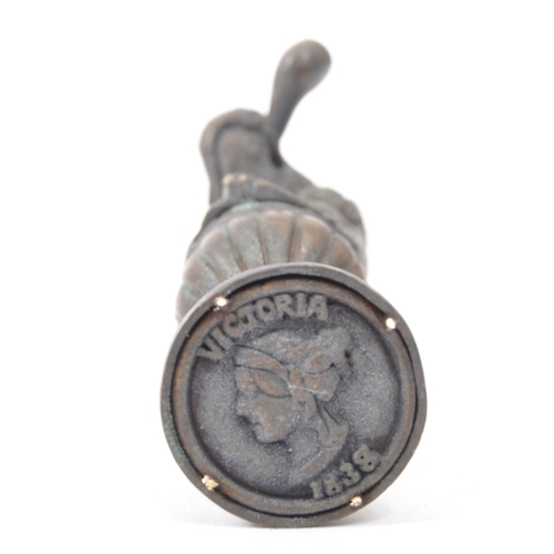 251a - A Victorian style brass seal in the form of a dog smoking a pipe with moulded details. Measures 6.5c... 