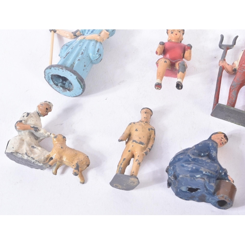 126 - A collection of vintage Britain's lead toy farm yard figurines to include; farmers / farm hands, mil... 