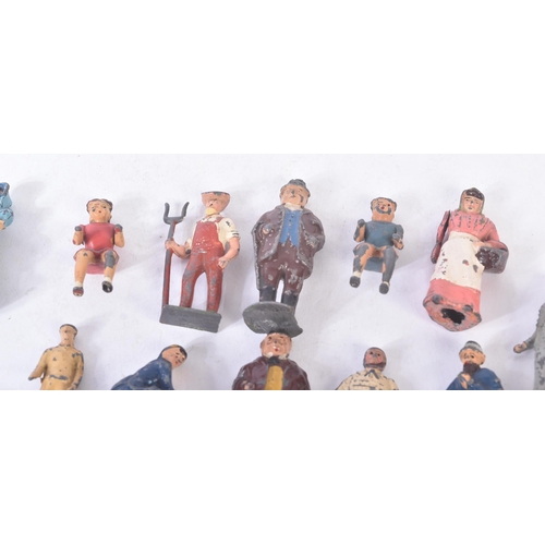 126 - A collection of vintage Britain's lead toy farm yard figurines to include; farmers / farm hands, mil... 