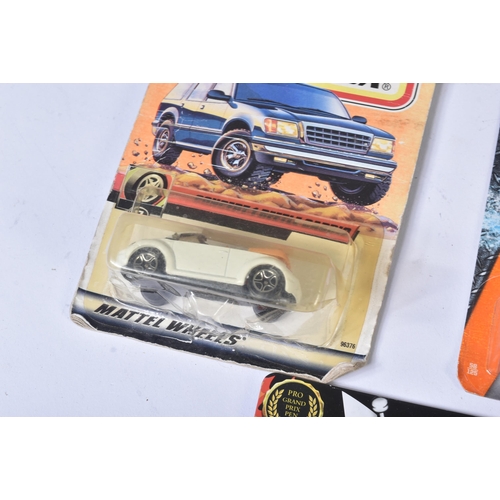 133 - A collection of assorted carded diecast model cars and other vehicles. Largely Matchbox and Hotwheel... 