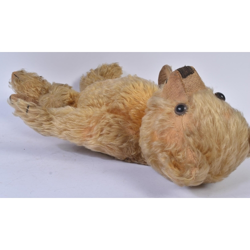 147 - A vintage English soft toy teddy bear, likely Chiltern or Chad Valley. The bear having golden mohair... 