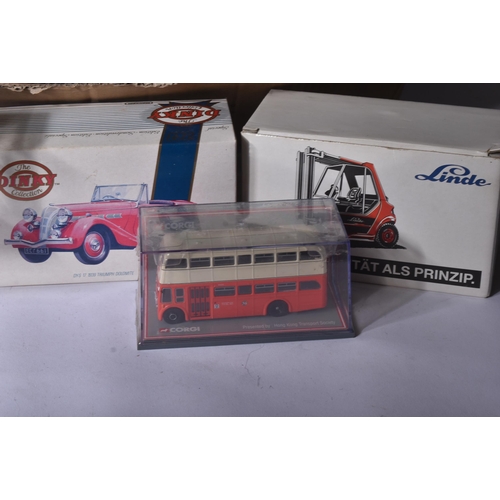 163 - A large collection of assorted boxed diecast model cars and other vehicles of various scales and mak... 