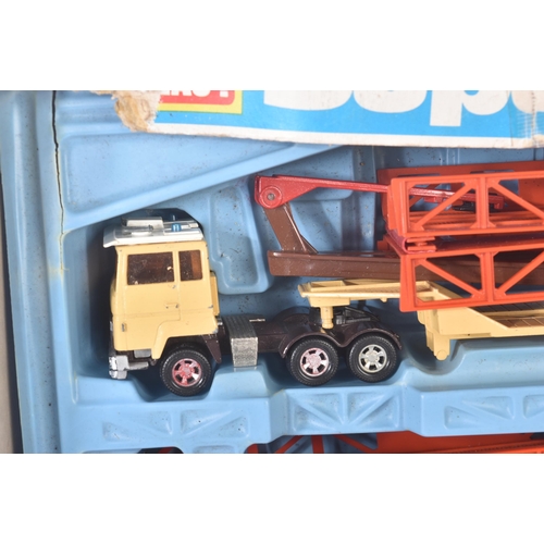 166 - A vintage Matchbox Super Kings boxed set No. K-44 Bridge Layer. The set containing a diecast cab and... 