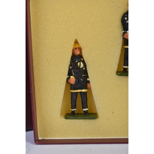 187 - A collection of vintage 1990s hand painted white metal fire fighter model figurines. The Firemen in ... 