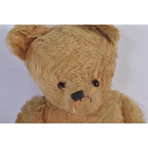 199 - A large vintage English soft toy teddy bear, likely Chiltern or Chad Valley. The bear having golden ... 