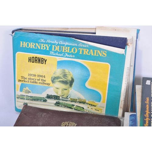 235 - A collection of assorted train, diecast and vintage toy hardback reference books to include; Tri-ang... 