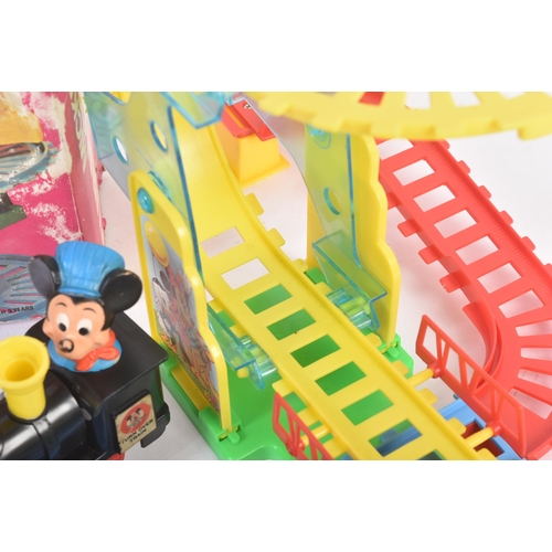 272 - A vintage Mickey Mouse ' Turn Over Choo Choo ' Disney train. The battery operated train rides along ... 