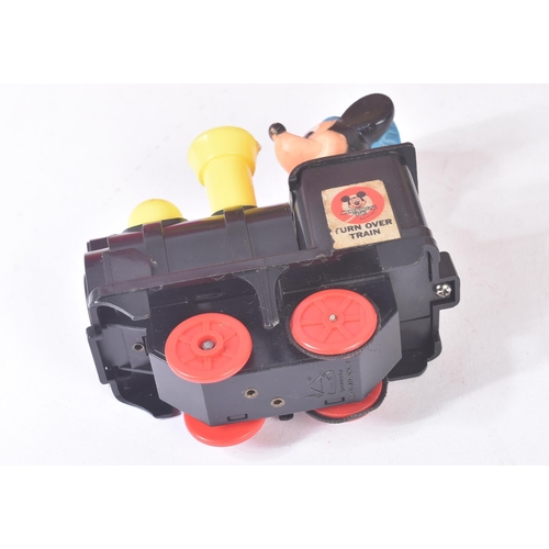 272 - A vintage Mickey Mouse ' Turn Over Choo Choo ' Disney train. The battery operated train rides along ... 