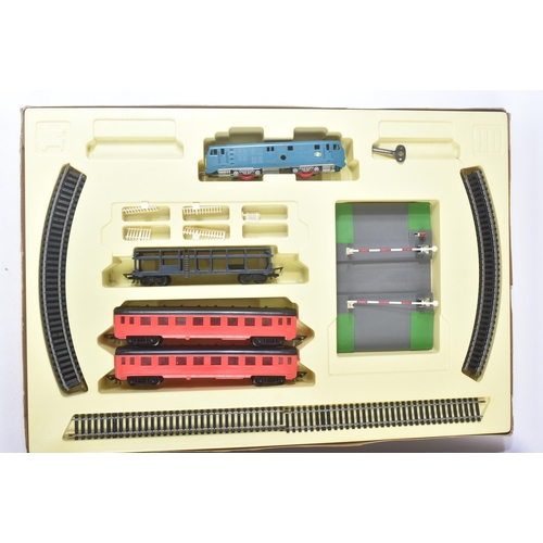 278 - A vintage Jouef made OO gauge model railway clockwork locomotive set and an Ideal Toy Tank Command s... 