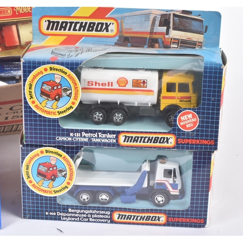 283 - A collection of assorted boxed diecast model cars, trucks and lorries of various markers. Examples t... 