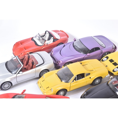 313 - A collection of x10 assorted 1/18 scale loose diecast model cars by makers Maisto, Jadi, Majorette, ... 