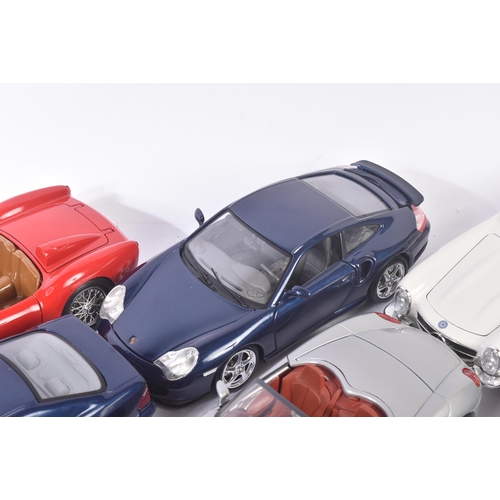 317 - A collection of x10 assorted 1/18 scale loose diecast model cars by makers Burago / Bburago, Maisto,... 