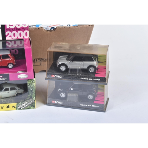 319 - A collection of assorted boxed diecast model cars and other vehicles of various scales and makers. E... 