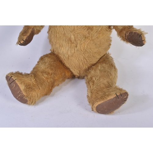 358 - A vintage English, likely Chad Valley or Chiltern made, soft toy teddy bear. The bear firmly stuffed... 