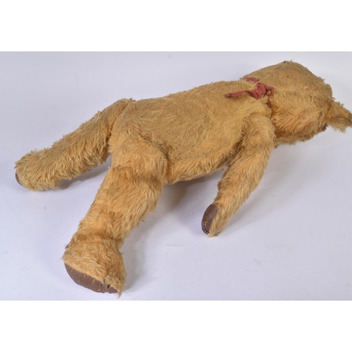 358 - A vintage English, likely Chad Valley or Chiltern made, soft toy teddy bear. The bear firmly stuffed... 