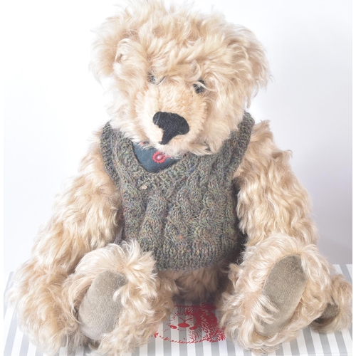 369 - A collection of x3 soft toy teddy bears comprising; Steiff 013393 ' Manschli ' a brown plush example... 