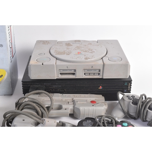 385 - Retro Gaming - a vintage PS Playstation video game console bundle comprising x4 original Playstation... 