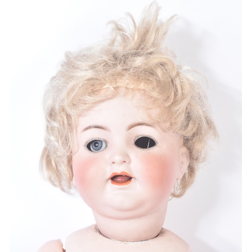 394 - An early 20th Century German Simon & Halbig bisque headed doll. Blue flirty eyes (x1 AF), finely pai... 