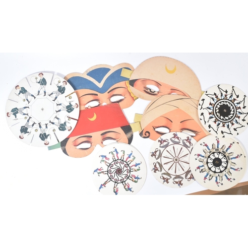 489 - A collection of vintage paper fancy dress / halloween masks along with a selection of pre-silm Zoetr... 