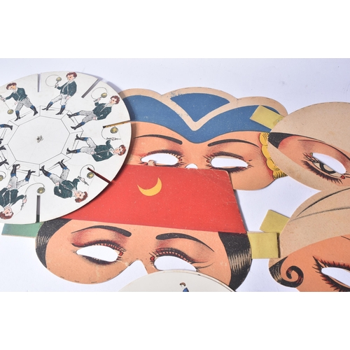 489 - A collection of vintage paper fancy dress / halloween masks along with a selection of pre-silm Zoetr... 