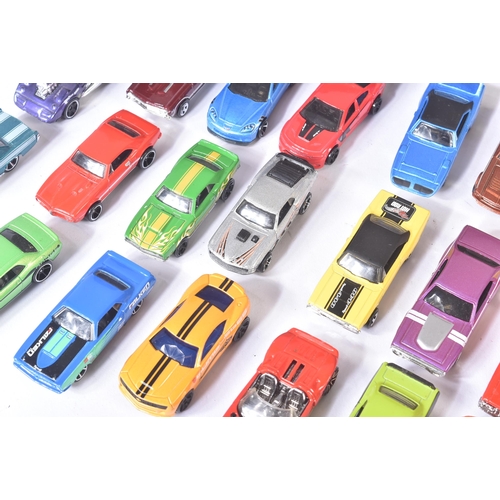 85 - A collection of assorted vintage loose diecast model cars, largely Mattel made Hot Wheels along with... 