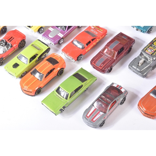 85 - A collection of assorted vintage loose diecast model cars, largely Mattel made Hot Wheels along with... 