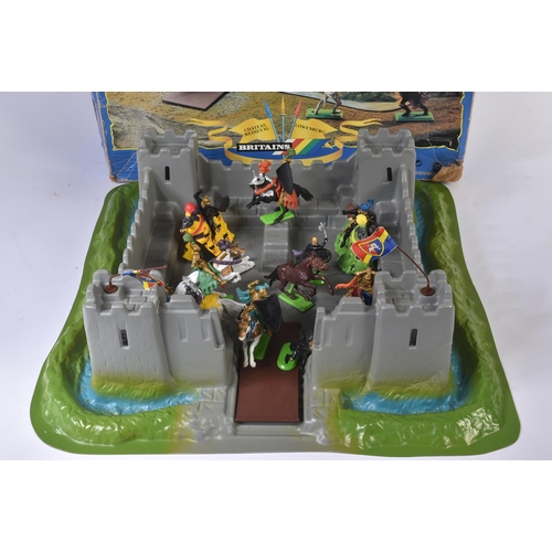 521 - An original vintage Britains made Knights Of The Sword Lion Castle playset. The set with a diorama c... 