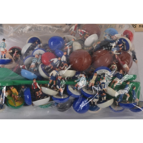 581 - A collection of vintage Subbuteo tabletop football teams and empty boxes. The figures appearing ligh... 