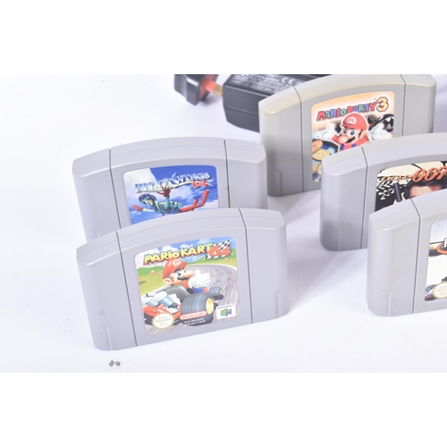 615 - Retro Gaming - a vintage N64 Nintendo 64 video game console with a selection of games and rumble pak... 