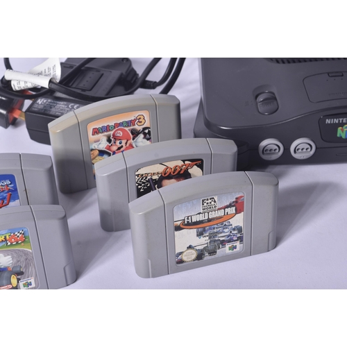 615 - Retro Gaming - a vintage N64 Nintendo 64 video game console with a selection of games and rumble pak... 