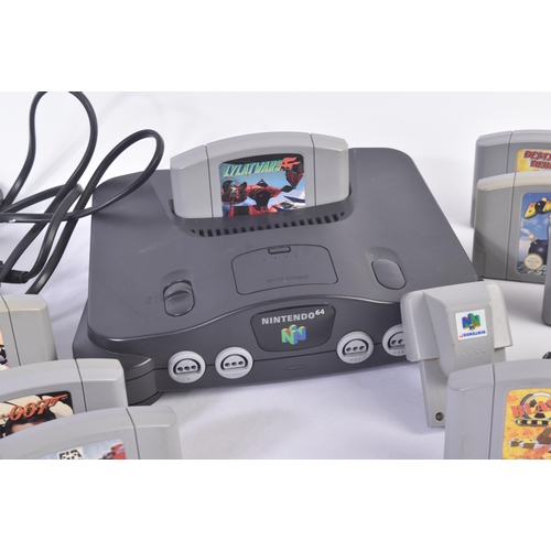 615 - Retro Gaming - a vintage N64 Nintendo 64 video game console with a selection of games and rumble pak... 