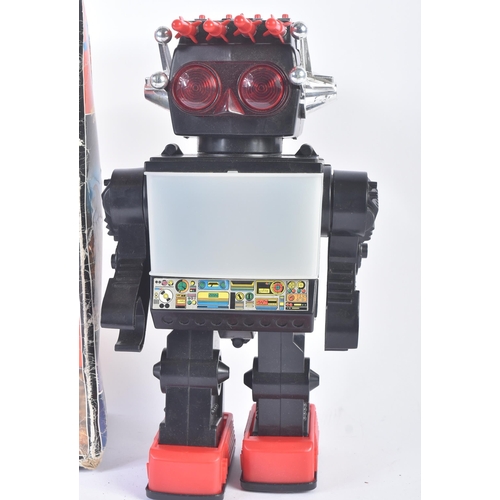 678 - A vintage battery operated ' Jupiter ' robot with light up eyes, central TV screen, missile shooting... 