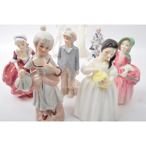 111 - A collection of 20th century bone china figurines to include Royal Doulton Moments collection Gradua... 
